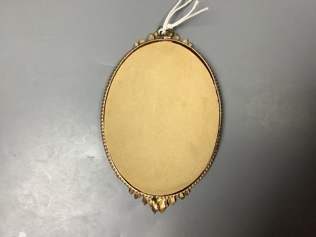 A portrait miniature of a lady, in a brass frame